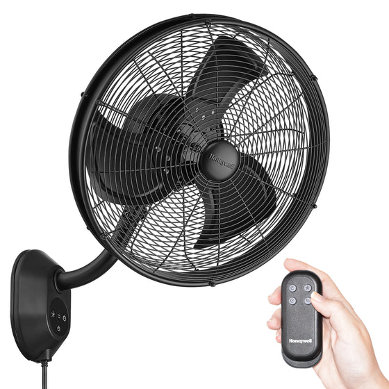 Black wall-mounted Honeywell fan with remote control on a white background