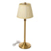Gold table lamp with a beige pleated shade on a white background