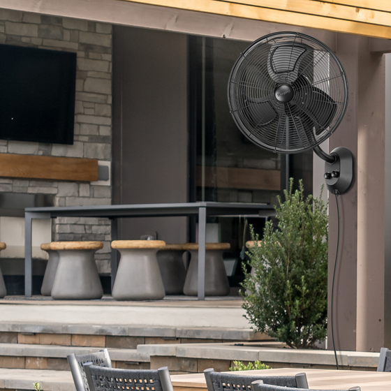 MULE Honeywell 18-inch wet-rated outdoor oscillating wall fan in black, side view