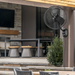 MULE Honeywell 18-inch wet-rated outdoor oscillating wall fan in black, side view