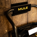Mule wall bracket with item hanging from it