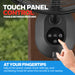 Touch panel control on a Honeywell fan with a hand adjusting settings, against a blurred green outdoor background.